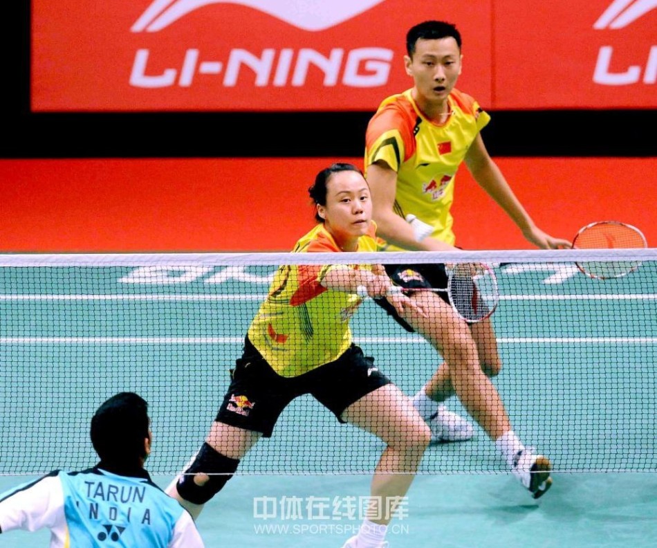Zhang Nan, right, and his partner Zhao Yunlei of China compete against Tarun Kona and Ashwini Ponnappa of India during their mixed doubles badminton match at the Sudirman Cup world team badminton championships in Kuala Lumpur, Malaysia, on May 19, 2013. 