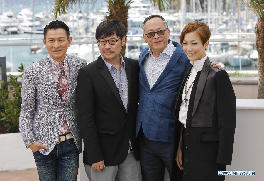 (L-R) Chinese Hong Kong actor Andy Lau, screenwriter Ka-Fai Wai, film director Johnnie To and actress Sammi Cheng pose during the photocall for Hong Kong film 'Blind Detective' at the 66th Cannes Film Festival in Cannes, southern France, on May 20, 2013. The film 'Blind Detective' is presented in Midnight Projections at the film festival. [Zhou Lei/Xinhua]
