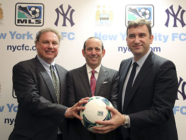 New York Yankees president Randy Levine, left, Major League Soccer Commissioner Don Garber, center, and Manchester City CEO Ferran Soriano at the MLS headquarter in New York on Tuesday.