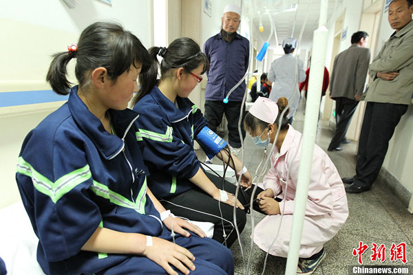 A total of 548 students fell ill after consuming milk and biscuits in schools in northwest China's Qinghai Province on May 22, 2013. [Photo/chinanews.com] 