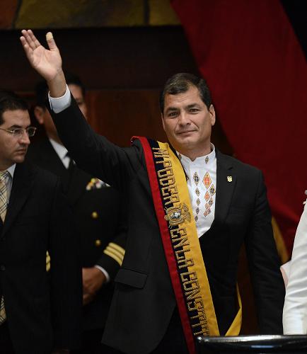 Ecuadorean President Rafael Correa waves during his inauguration for a third term (2013-2017) in Quito, on May 25, 2013. [Xinhua photo]