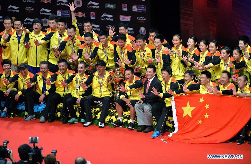 Players of China celebrate during the awarding ceremony after the final match against South Korea at the Sudirman Cup World Team Badminton Championships in Kuala Lumpur, Malaysia, on May 26, 2013. Team China won the champion with 3-0.