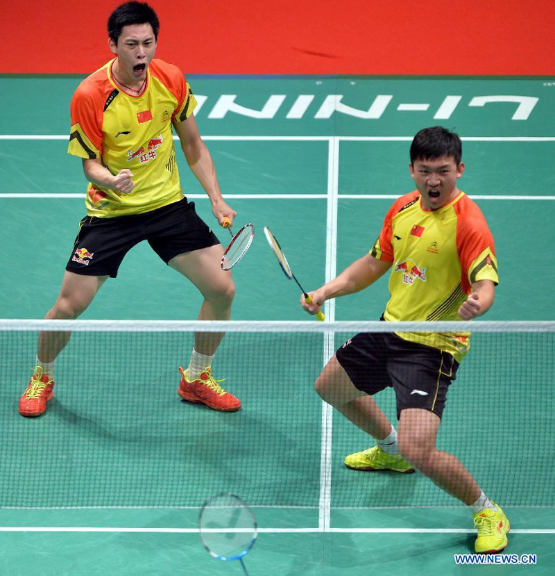 Liu Xiaolong (L) and Qiu Zihan of China celebrate during the men&apos;s doubles match against South Korea&apos;s Ko Sung Hyun/Lee Yong Dae at the finals of the Sudirman Cup World Team Badminton Championships in Kuala Lumpur, Malaysia, on May 26, 2013. Team China won the champion with 3-0. 