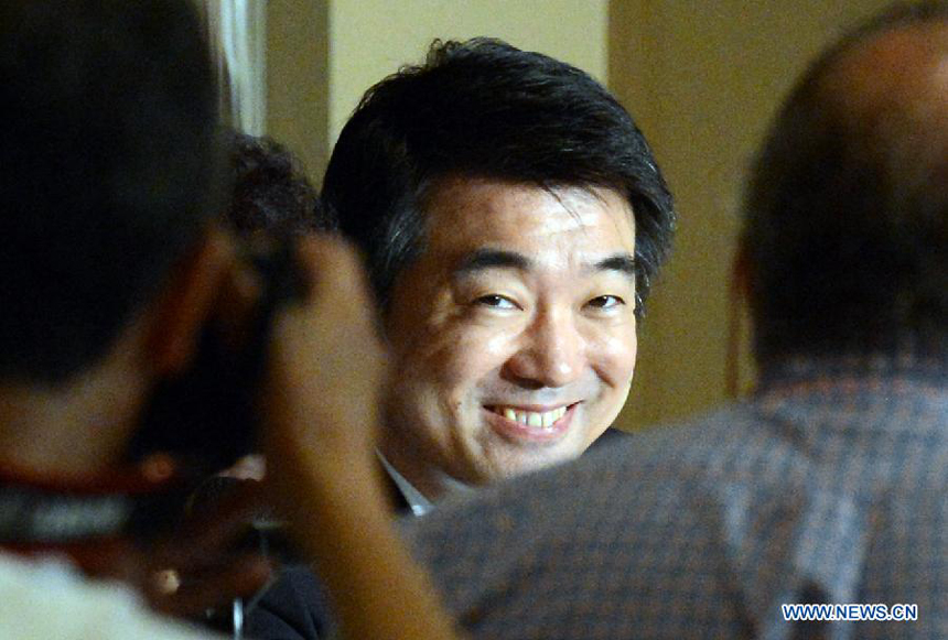 Osaka Mayor Toru Hashimoto (C) reacts during a press conference at the Foreign Correspondents&apos; Club of Japan in Tokyo, May 27, 2013. Toru Hashimoto on Monday denied his remarks on wartime so-called &apos;comfort women&apos; at Foreign Correspondents&apos; Club of Japan, saying it was not his intention at all to say women who were used as sexual slaves during wartime are necessary.