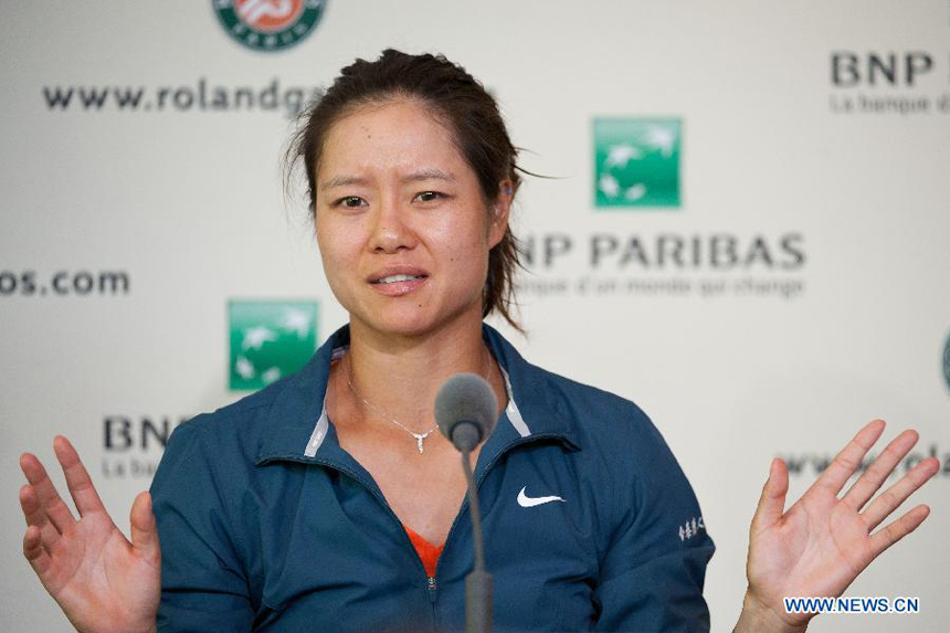 Li Na of China speaks at the post match press conference after winning her women&apos;s singles first round match against Anabel Medina Garrigues of Spain on day 2 of the 2013 French Open tennis tournament at Roland Garros in Paris, France on May 27, 2013. Li Na won 2-0.