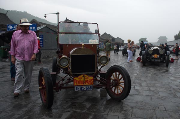 A Ford Model T, the oldest participating vehicle in the Beijing-to-Paris classic car rally, is ready to hit the road at Juyongguan section of the Great Wall, Beijing, May 28, 2013. The car was produced in 1913.[Photo by Wei Xiaohao/Asianewsphoto] 