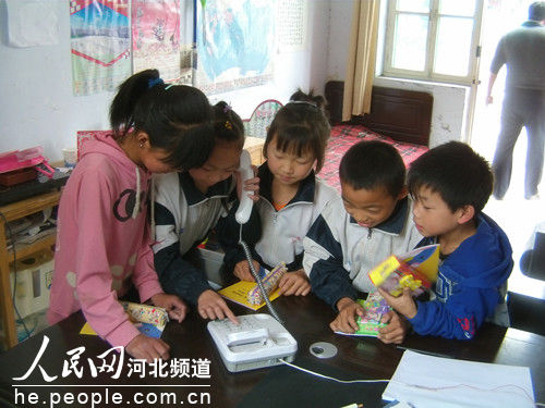 'Left-behind children' make phone calls to their parents in a primary school in Hebei Province. The Supreme People's Court has vowed 'zero tolerance' of crimes that affect the rights of children, highlighting sexual abuse and corporal punishment.