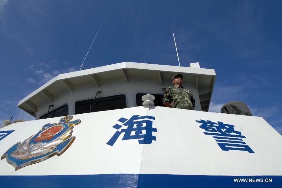 A marine officer looks out on the China Coast Guard vessel 46001, south China&apos;s Hainan Province, May 31, 2013. The vessel accomplished a 10-hour patrol of the sea areas around Yongle Islands on Friday. (Xinhua/Wei Hua)