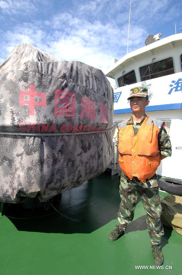 A marine officer is on duty on the China Coast Guard vessel 46001, south China&apos;s Hainan Province, May 31, 2013. The vessel accomplished a 10-hour patrol of the sea areas around Yongle Islands on Friday. (Xinhua/Wei Hua)