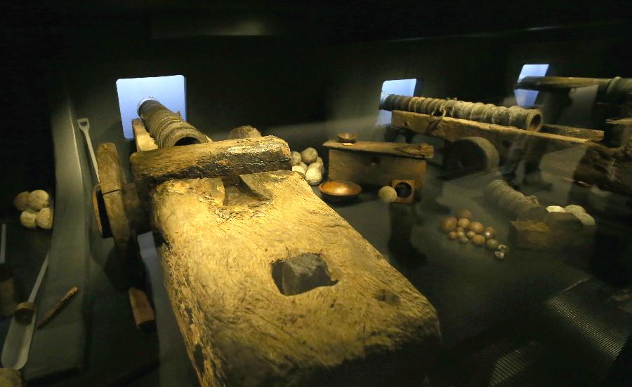 Cannons of the Mary Rose are seen at Mary Rose museum in south England&apos;s Portsmouth, April 25, 2013. The Mary Rose museum opened here on May 31, 2013. The new museum, at the historic dockyard in Portsmouth and in the shape of the bow of a black ship, was aimed at taking visitors to a journey through 500 years, so as to learn the story of the Mary Rose, one of the largest and most famous ships in the English navy. (Xinhua/Yin Gang)