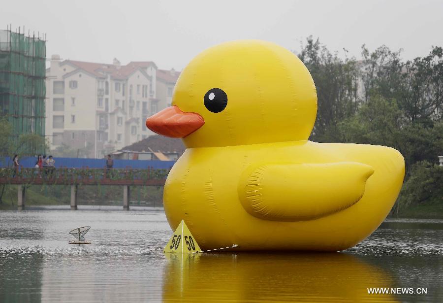 The duck, made by a property company, is a mini copy of the huge rubber duck which appeared in Hong Kong, south China, on May 2. 