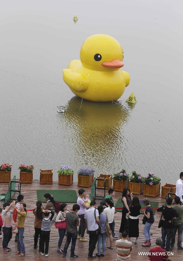 The duck, made by a property company, is a mini copy of the huge rubber duck which appeared in Hong Kong, south China, on May 2. 