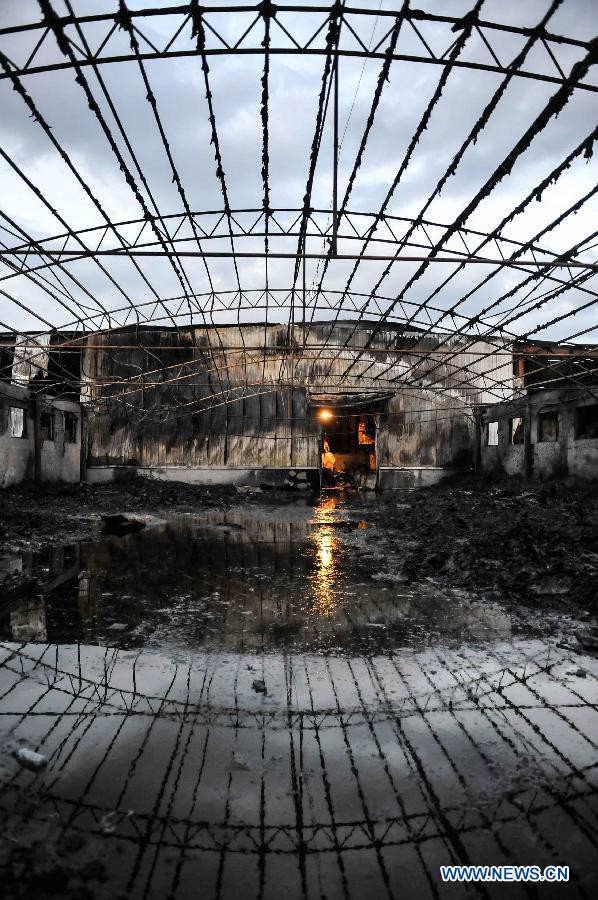 Photo taken on June 3, 2013 show the burnt poultry slaughterhouse owned by the Jilin Baoyuanfeng Poultry Company in Mishazi Township of Dehui City in northeast China&apos;s Jilin Province. The death toll from the fire has risen to 119 as of 8 p.m. on Monday. Search and rescue work is under way.