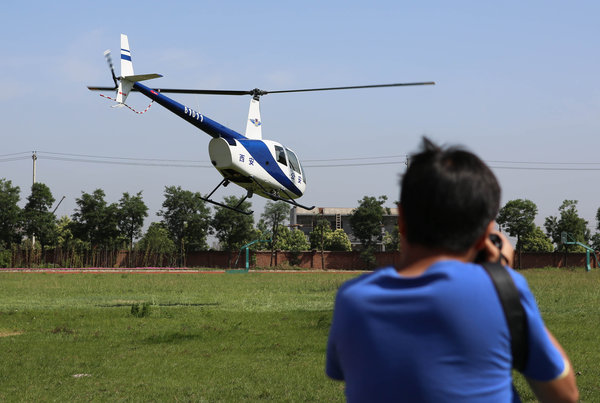The police helicopter takes off in Xi'an, Northwest China's Shaanxi province, June 1, 2013. [Photo/CFP] 