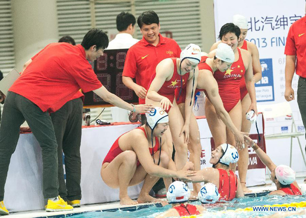 Players of China celebrates victory after the semifinal against the United States at the 2013 FINA Women's Water Polo World League Super Final in Beijing, capital of China, June 5, 2013. China won 9-7. [Zhang Yu/Xinhua]