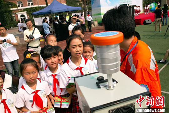 An environmental protection workers show air pollution surveying instruments to students in a primary school in Chengdu, Sichuan Province, on June 3. World Environment Day is celebrated every year on 5 June to raise global awareness of the need to take positive environmental action. It is run by the United Nations Environment Program (UNEP). 