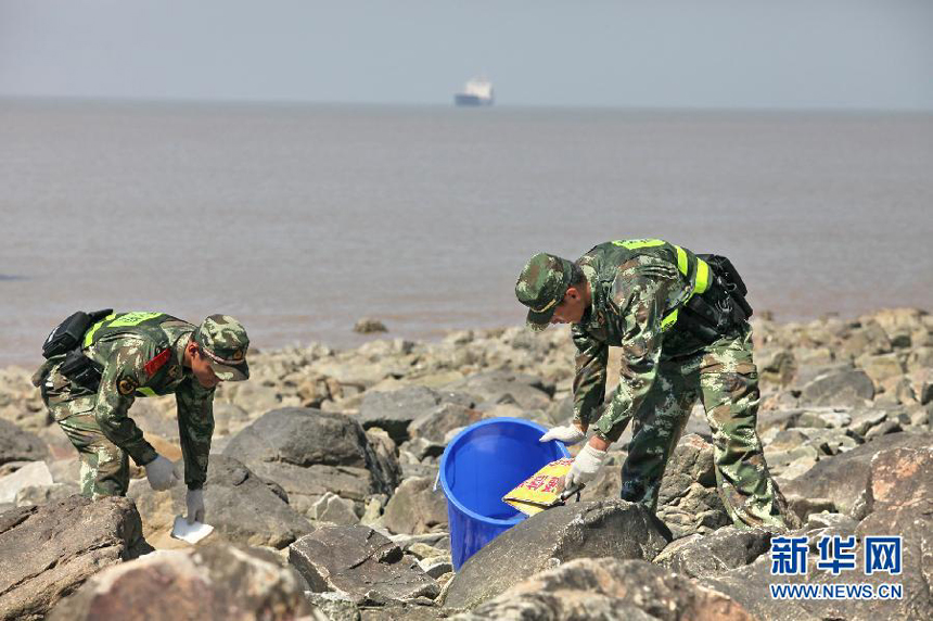 Soldiers clean up a beach in Shanghai on June 3. World Environment Day is celebrated every year on 5 June to raise global awareness of the need to take positive environmental action. It is run by the United Nations Environment Program (UNEP). 