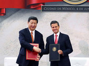 President Xi Jinping and his Mexican counterpart Enrique Pena Nieto celebrate after they signed a joint declaration in Mexico City on Tuesday. [Yao Dawei/Xinhua]