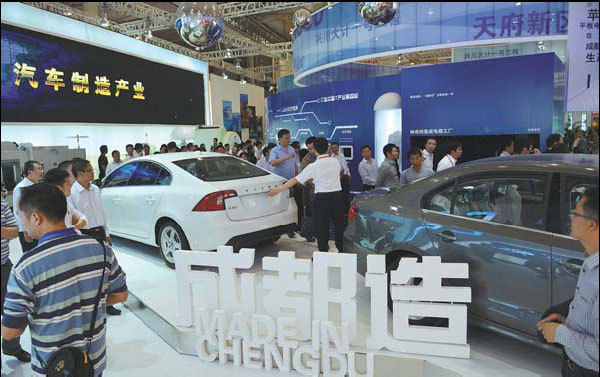 Chengdu-made cars displayed at the Western China International Fair attract attention from visitors. The city is now the third-largest auto production center in the country and the biggest in the western region. DuPont is making products for the city's auto industry. [China Daily]