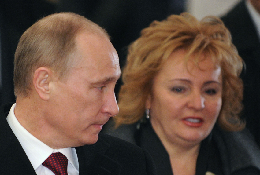 A file picture taken on March 4, 2012, shows Russia&apos;s President, then Prime Minister and presidential candidate, Vladimir Putin (L) and his wife Lyudmila arriving in a polling station in Moscow. Vladimir Putin and his wife announced today on state TV they are divorcing.