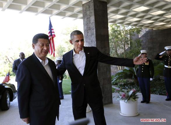 Chinese President Xi Jinping is greeted by U.S. President Barack Obama at the Annenberg Retreat, California, the United States, June 7, 2013. Chinese President Xi Jinping and his U.S. counterpart, Barack Obama, met Friday to exchange views on major issues of common concern. [Xinhua/Lan Hongguang] 