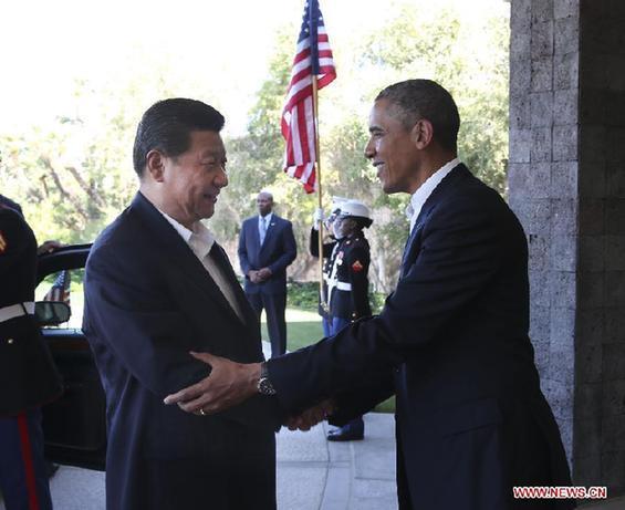 Chinese President Xi Jinping (L) shakes hands with U.S. President Barack Obama at the Annenberg Retreat, California, the United States, June 7, 2013. Chinese President Xi Jinping and his U.S. counterpart, Barack Obama, met Friday to exchange views on major issues of common concern. [Xinhua/Lan Hongguang] 