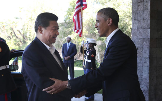 Chinese President Xi Jinping (L) shakes hands with U.S. President Barack Obama at the Annenberg Retreat, California, the United States, June 7, 2013. Chinese President Xi Jinping and his U.S. counterpart, Barack Obama, met Friday to exchange views on major issues of common concern. [Xinhua/Lan Hongguang]