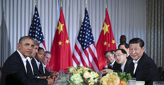 Chinese President Xi Jinping (1st R) meets with U.S. President Barack Obama (1st L) at the Annenberg Retreat, California, the United States, June 7, 2013. Chinese President Xi Jinping and his U.S. counterpart, Barack Obama, met Friday to exchange views on major issues of common concern. [Lan Hongguang/Xinhua]