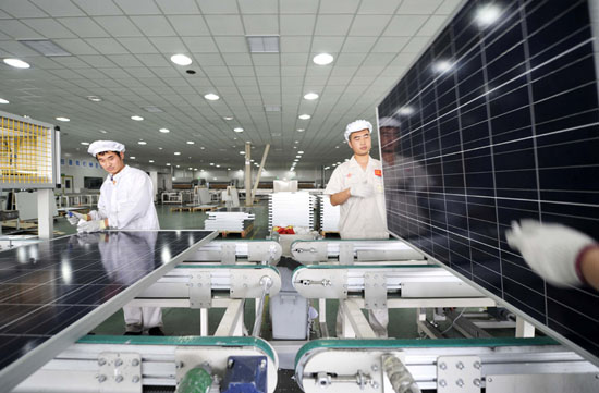 In the photo, employees work on a production line of solar panels in Yinglin Solar Comany in Tianjin on June 5. The European Commission announces Tuesday a plan to impose punitive anti-dumping duties on Chinese solar panel imports despite opposition from Germany and other European Union members. [Photo/Xinhua]