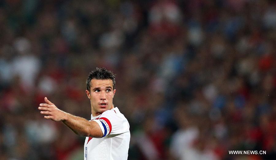 Robin van Persie of the Netherlands gestures during the international friendly soccer match against China at the Workers Stadium in Beijing, capital of China, June 11, 2013. (Xinhua/Li Ming) 