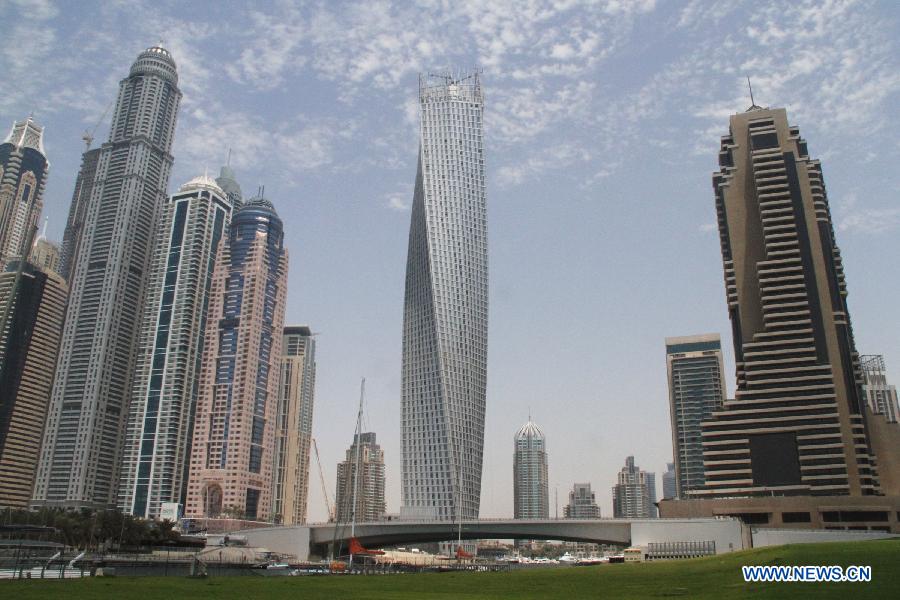 Photo taken on June 11, 2013 shows the Cayan Tower in Dubai's prestigious Marina district, the United Arab Emirates (UAE). Saudi developer Cayan inaugurated late Monday the opening of the 73-storey, 310-meter-high Cayan Tower in Dubai's prestigious Marina district. (Xinhua/Li Zhen) 