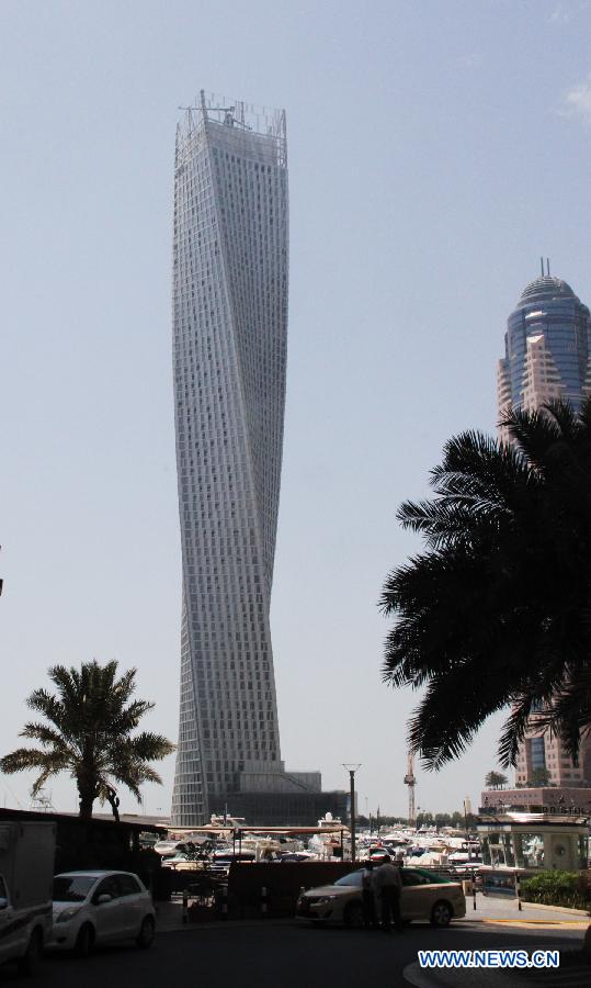 Photo taken on June 11, 2013 shows the Cayan Tower in Dubai's prestigious Marina district, the United Arab Emirates (UAE). Saudi developer Cayan inaugurated late Monday the opening of the 73-storey, 310-meter-high Cayan Tower in Dubai's prestigious Marina district. (Xinhua/Li Zhen) 