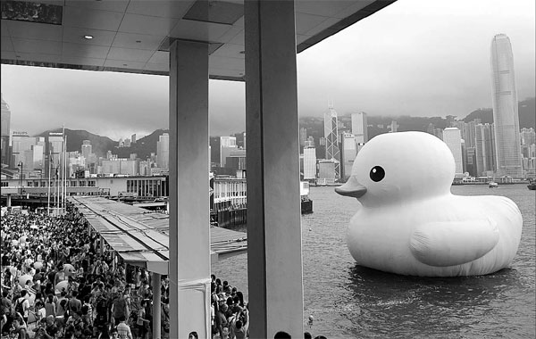 The Rubber Duck, designed by Dutch artist Florentijn Hofman, displays in Hong Kong. The giant duck has proved the economic value and importance of successful creative ideas, according to Hong Kong's Chief Executive Leung Chun-ying. [China Daily]