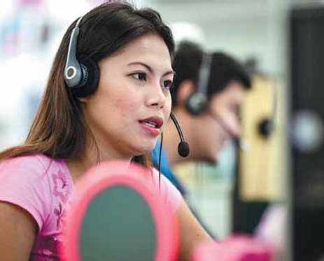 An employee on the phone as she works at an SPi Global call center in Manila, capital of the Philippines. Manila-based SPi Global's 18,000 workers handle customer support, technical problems and other tasks for overseas clients. India, the Philippines and some other Asian economies are known for their business process outsourcing industry thanks to their English language advantages. Now the trend is also taking place in the inland cities of China. [China Daily]