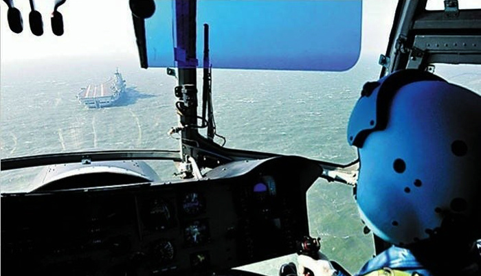 This photo released on June 18, 2013 records China's aircraft carrier Liaoning conducting training sessions. [Photo/Huanqiu.com]