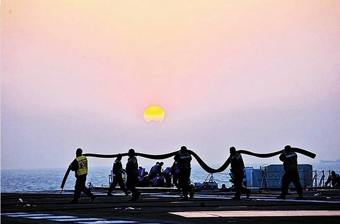 This photo released on June 18, 2013 records China's aircraft carrier Liaoning conducting training sessions. [Photo/Huanqiu.com] 