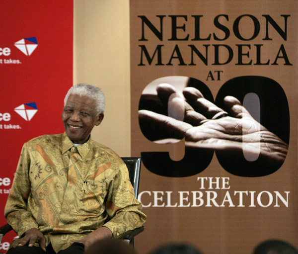 Former South African President Nelson Mandela smiles during the launch of postal stamps in Houghton, outside Johannesburg July 15, 2008, issued by the South African Post Office to celebrate his 90th birthday.[Xinhua]