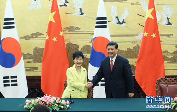 President Xi Jinping and ROK President Park Geun-hye hold talks in Beijing on Thursday. 