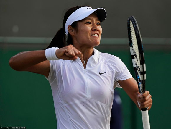 Li Na of China celebrates after defeating Klara Zakopalova of the Czech Republic during their third round match for the Wimbledon Championships at the All England Lawn Tennis Club, in London, Britain, 29 June 2013.