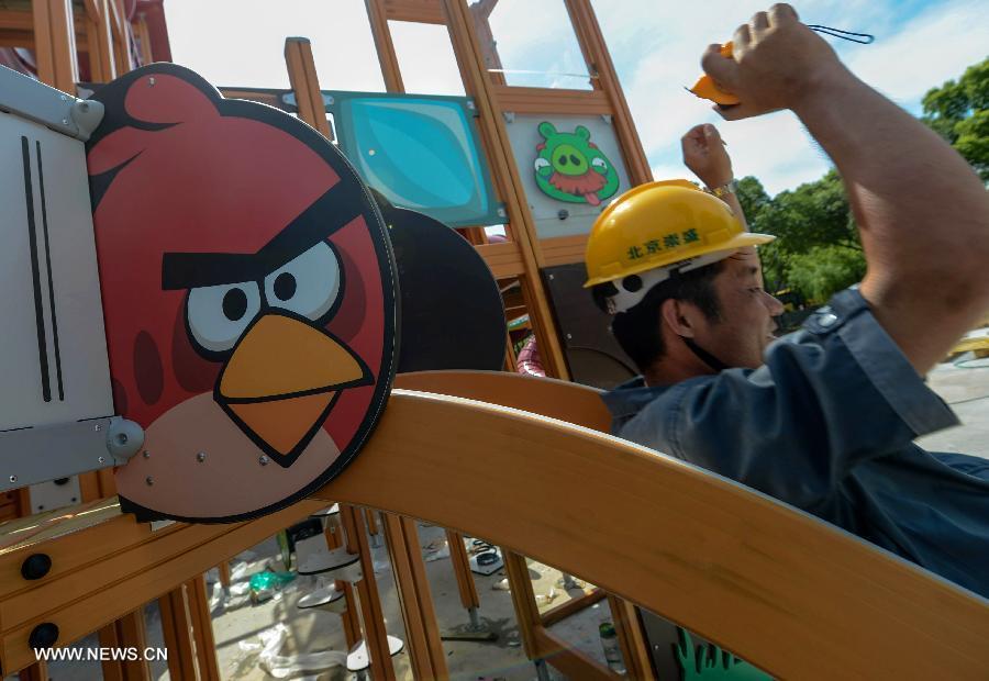 A worker is seen at an Angry Birds theme park in Haining, East China's Zhejiang province, July 2, 2013. The Angry Birds theme park, the first of its kind in China, is under construction and is expected to open to the public in October. Angry Birds, created by the Finland-based Rovio Entertainment, is a popular game for smartphones and tablet computers. [Xinhua]