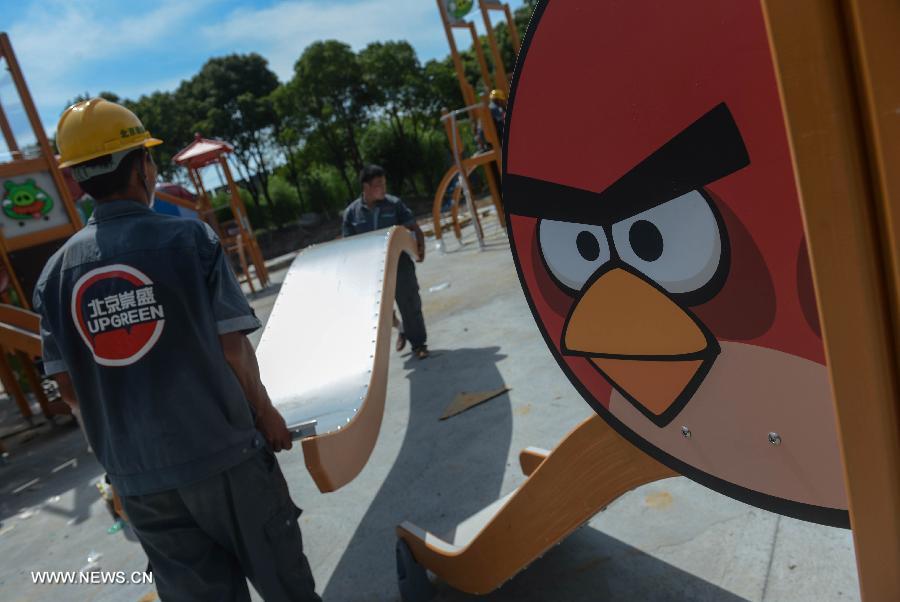 Jari Pyykka, a Finnish technical consultant, works at an Angry Birds theme park in Haining, East China's Zhejiang province, July 2, 2013. The Angry Birds theme park, the first of its kind in China, is under construction and is expected to open to the public in October. Angry Birds, created by the Finland-based Rovio Entertainment, is a popular game for smartphones and tablet computers.[Xinhua]