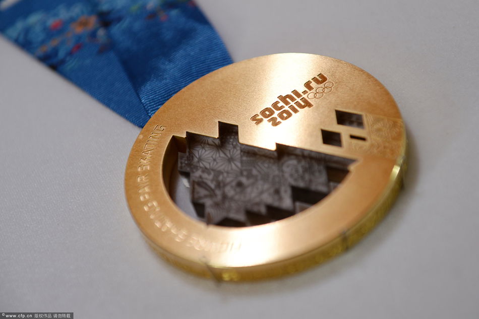 A gold medal manufactured for the 2014 Winter Olympic Games in Sochi, is seen on display at the Adamas jewellery factory in Moscow, June 28, 2013.