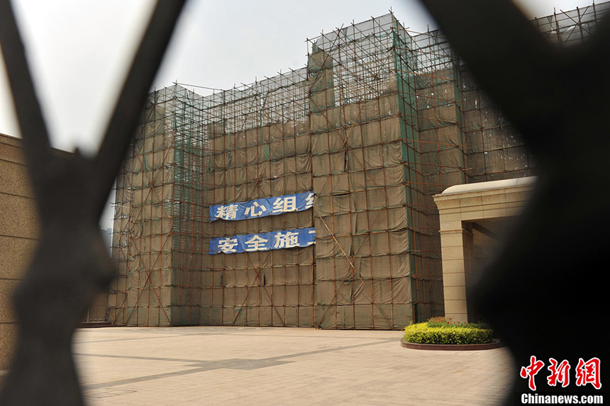 The former site of the Song Qing Ling statue surrounded by a thick protective net July 4.