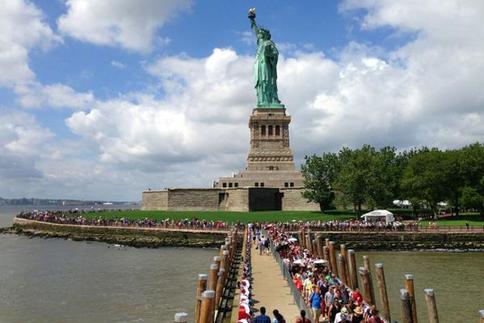 Americans queued to see the Statue of Liberty as it was opened to the public for the first time after being shut since Superstorm Sandy hit Liberty Island last year. 