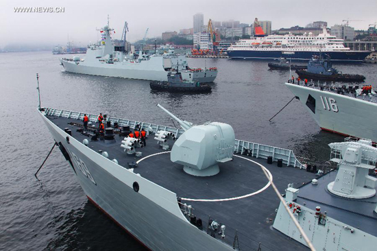 Chinese navy vessels leave for joint naval drills from a port in Vladivostok, Russia, July 8, 2013. China and Russia started on Monday the joint naval drills off the coast of Russia's Far East. (Xinhua/