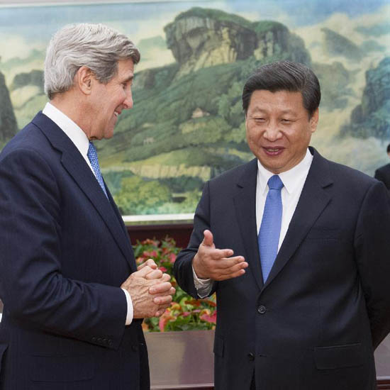 Chinese President Xi Jinping (R) talks with U.S. Secretary of State John Kerry in Beijing, capital of China, April 13, 2013. [Xinhua photo]