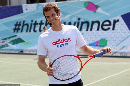 Andy Murray of Great Britain smiles during an event to meet fans following his victory in the Wimbledon Open.