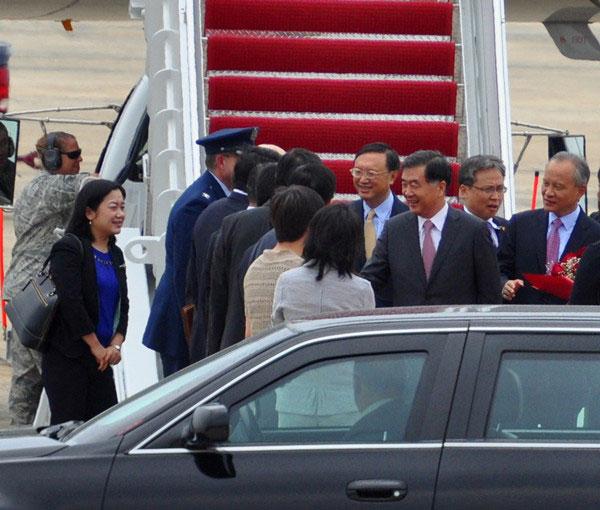 Chinese Vice Premier Wang Yang (3rd, R) and State Councilor Yang Jiechi (4th,R) shake hands with delegates from US at Joint Base Andrews outside Washington DC on Tuesday, July 9, 2013. 