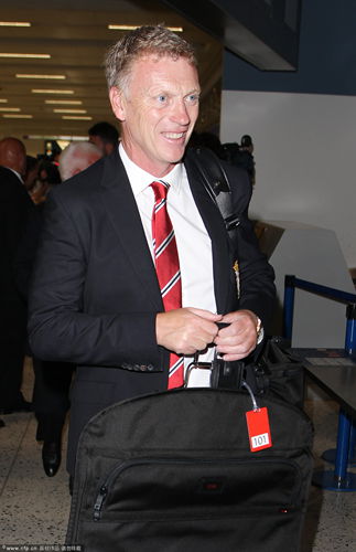 David Moyes seen at Manchester Airport before flying out for Manchester United's pre-season tour, in Manchester. 