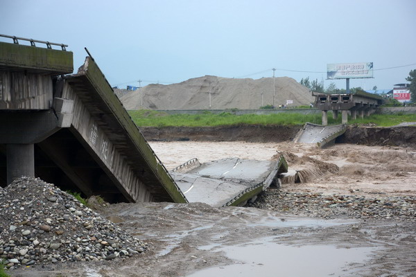 A bridge collapses due to rainstorms in Deyang city, Southwest China's Sichuan province, July 9. [Photo/Xinhua]